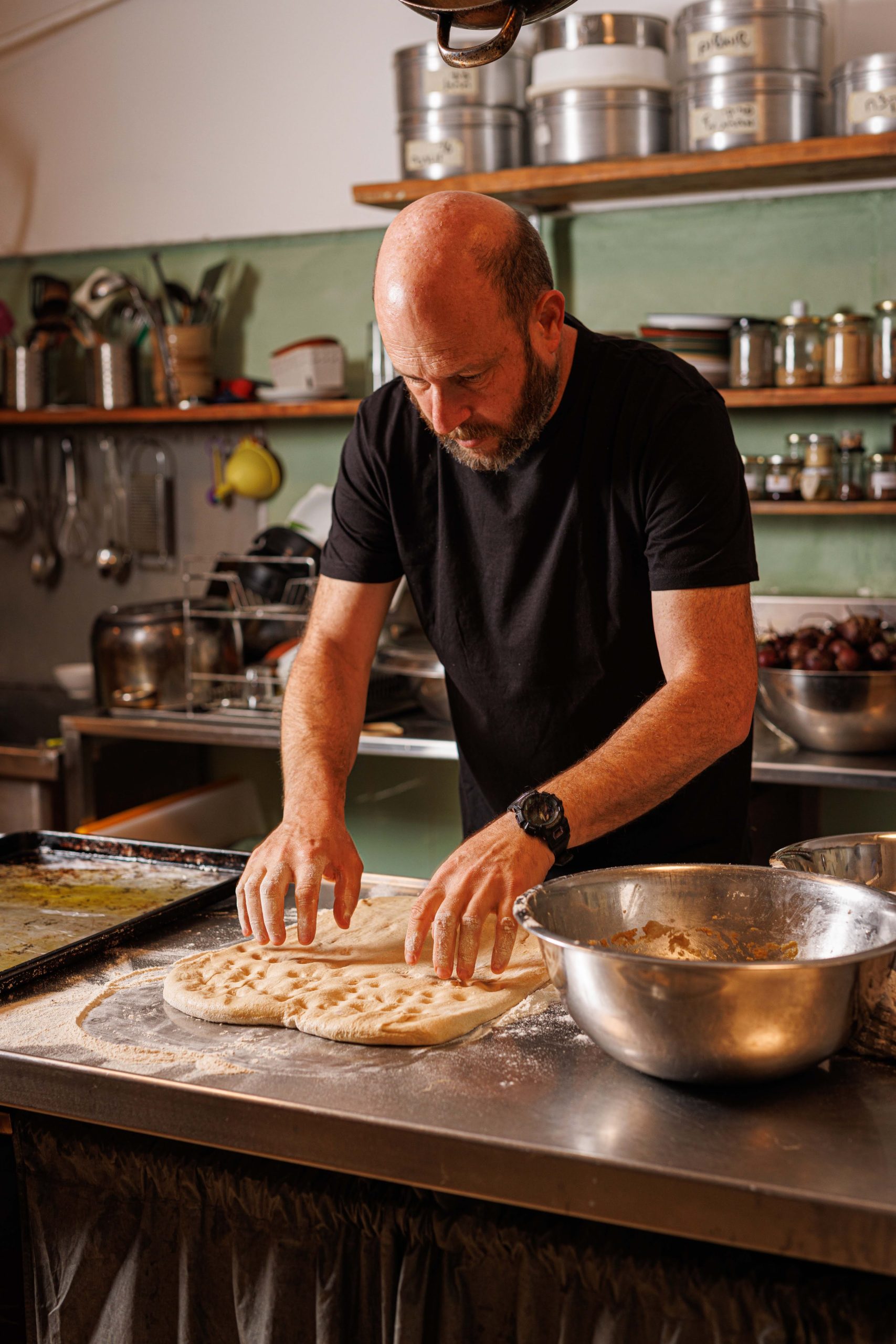 Uri Mayer-Chissick preparing bread in the Center kitchen